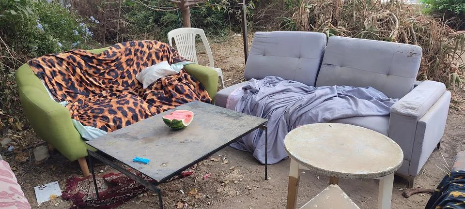 Sofas, table and chairs outside in the courtyard of the house in summer, fu.. Stock Photos