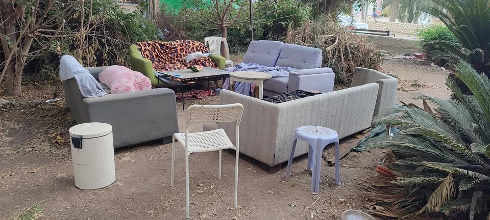 Sofas, table and chairs outside in the courtyard of the house in summer, fu.. Stock Photos