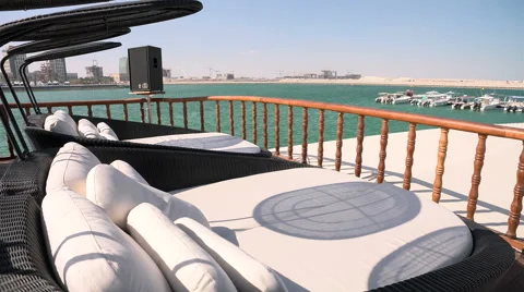 Sofas on the terrace of a dhow docked during Qatar International Boat Show  Stock Footage 58657060