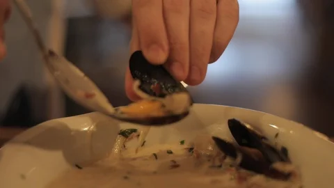 Sofct Focus of Eating Mussels in Fancy Restaurant Stock Footage 129340695