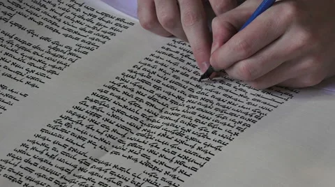 Sofer finishing the final letters of a sefer Torahwork Stock Footage 66461060