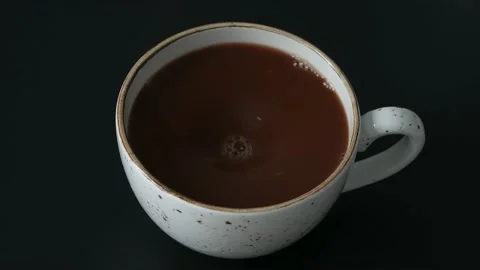 Сoffee after stirring in a cup. Slow motion. Stock Footage 231795144