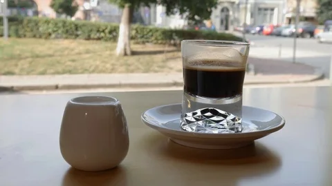 Сoffee and milk on table inside cafe Stock Footage 94481569