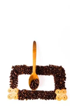 Сoffee beans and spoon Stock Photos