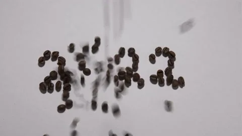 Сoffee beans lie on the table in the shape of the number 2022 Stock Footage 162775386