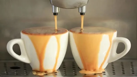Сoffee machine making espresso and coffee pouring out of two cups. Stock Footage 142510095