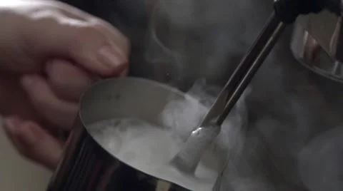 Сoffee machine steaming milk in slow motion Stock Footage 58865010