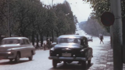 Sofia - 1967: Two way traffic moves on a busy street during daytime in Bulgaria Stock Footage 168601014