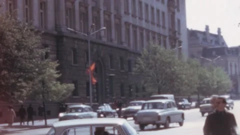 Sofia - 1967: View of a busy street at traffic hour - Directions signboard Stock Footage 168600990