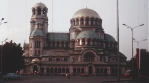 Sofia - 1969: downtown traffic in front of St. Alexander Nevsky Cathedral Stock Footage 170540736