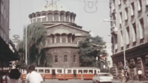 Sofia - 1969: trams and pedestrian near St Nedelya Church (Holy Sunday Church) Stock Footage 170540743