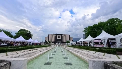 Sofia, Bulgaria - 06.06.2026. Wide panoramic view of fountains in front of the Stock Footage 336547354