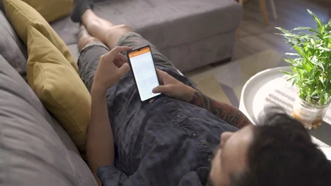 Sofia, Bulgaria-07 08 2021: Young man order food online from sofa take away 스톡 동영상 160115342