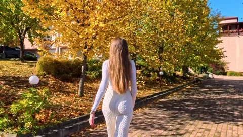 Sofia, Bulgaria - 10.19.2025. Young slender woman with long blond hair walks Stock Footage 319964320