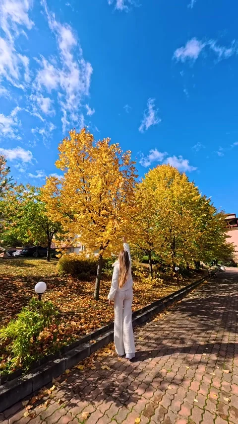 Sofia, Bulgaria - 10.19.2025. Young slender woman with long blond hair walks Stock Footage 319964716