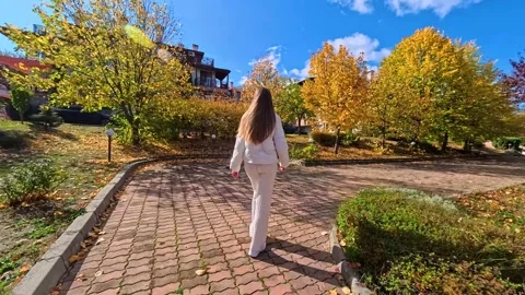 Sofia, Bulgaria - 10.19.2025. Young slender woman with long blond hair walks Stock Footage 319965631