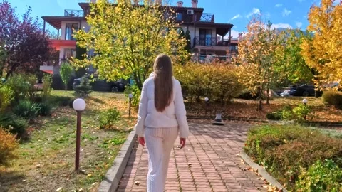 Sofia, Bulgaria - 10.19.2025. Young slender woman with long blond hair walks Stock Footage 319965633