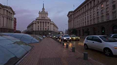 Sofia  , Bulgaria - 11/30/2023: Evening traffic at Nezavisimost ( Stock Footage 265526800