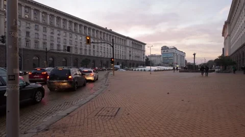 Sofia, Bulgaria - 11/30/2023: Evening traffic at Nezavisimost ( translates Stock Footage 265526850