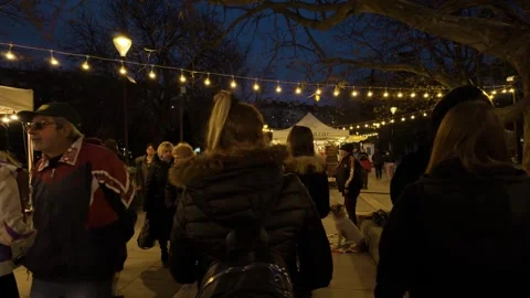 Sofia, Bulgaria - 12/12/2023: Moving through a crowd of people at night. Stock Footage 263776299