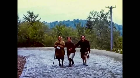 Sofia, Bulgaria, 1963 - In the countryside three female workers improvise dance 库存影片 191866185
