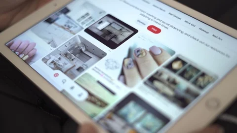 Sofia, Bulgaria-23 03 2020: Female hands scrolling Pinterest app on tablet Stock Footage 127031705