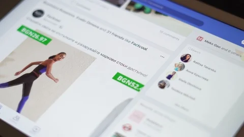 Sofia, Bulgaria-23 03 2020: Hand browsing through Facebook newsfeed on iPad Stock Footage 127182548