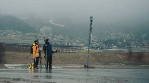 Sofia, Bulgaria 23 February 2017: Two skiers waiting for an old bus Stock Footage 141901983