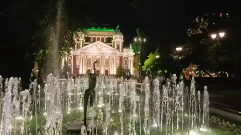 Sofia, Bulgaria - 9.20.2025. Night view of fountains in front of the Ivan Vazov Stock Footage 319560067