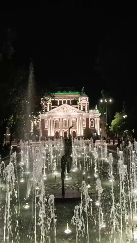 Sofia, Bulgaria - 9.20.2025. Night view of fountains in front of the Ivan Vazov Stock Footage 319560340