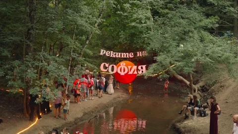 SOFIA, BULGARIA - AUGUST 29, 2026: People gather along the riverbank during the Stock-Footage 345453370