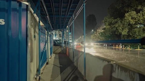SOFIA, BULGARIA - AUGUST 29, 2026: Cars driving on wet city street at night 動画素材 345901317