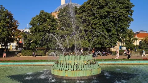 Sofia, Bulgaria. Central Baths Fountain, People and Banya Bashi Mosque on Sunny Stock Footage 313065185