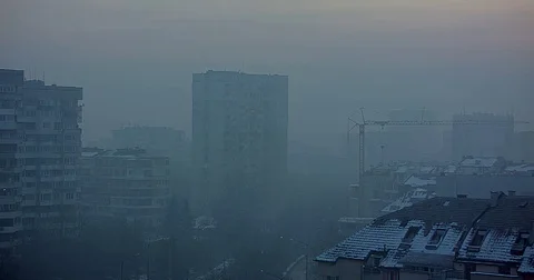 Sofia, Bulgaria on a cold winter morning, fog, air pollution, sun rise Stock Footage 85297469