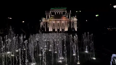 Sofia, Bulgaria. Ivan Vazov National Theatre and City Garden Fountains at Night Stock Footage 313101070