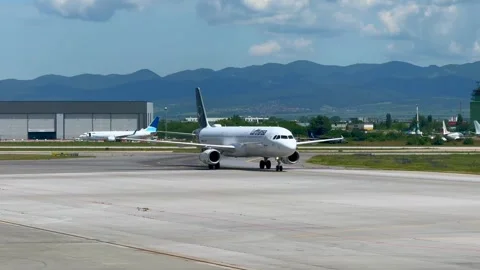 Sofia, Bulgaria - June 08, 2026: Airplane taxiing on the runway at an airport, w Stock Footage 341692219
