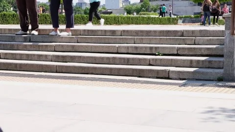 Sofia, Bulgaria - June 5, 2021: People passing by and walking up and down stone Stock Footage 155378601
