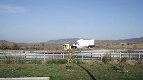 Sofia, Bulgaria - Mar 12, 2025: White delivery van being towed on a highway w Stock Footage 310334265