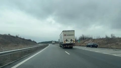 Sofia, Bulgaria - Noe 14, 2024: Trucks overtake driving on highway road. Stock Footage 250114514