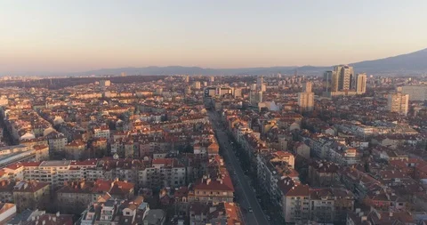 Sofia panoramic view at sunset with calm city traffic on long boulevard Stock Footage 125696459