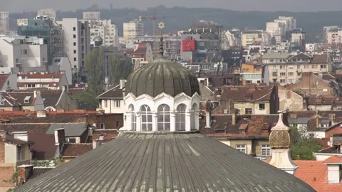 Sofia Synagogue dome above city buildings showing history and modern life Stock Footage 328477791