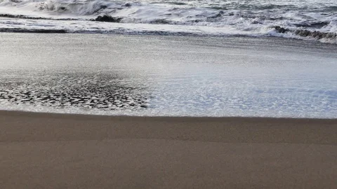 Soft and delicate waves flowing on smooth sandy coast. Stock Footage 99905541