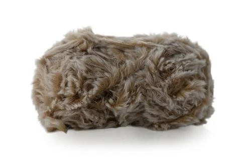 Soft and fluffy brown yarn resting in a cozy corner waiting to be transform.. Stock Photos