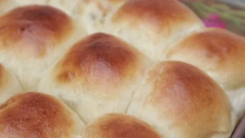Soft and fluffy homemade buns in tray  Stock Footage