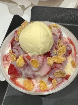 Soft and fluffy strawberry bingsu with finely shaved ice, sweet strawberry .. Stock Photos