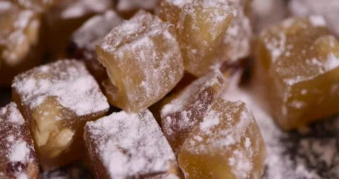 Soft and fresh Turkish delight sprinkled with a small amount of powdered white Stock Footage 327050998