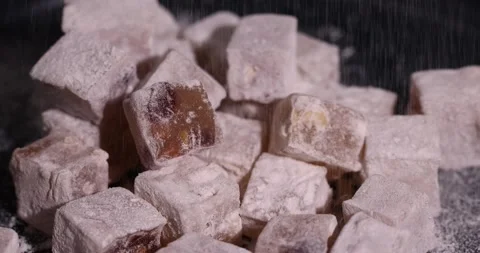 Soft and fresh Turkish delight sprinkled with powdered white sugar, sweet white Stock Footage 328099089