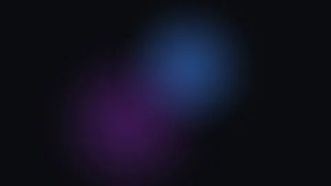 A soft and glowing purple light orb emerging from the deep black background Video stock 339618457