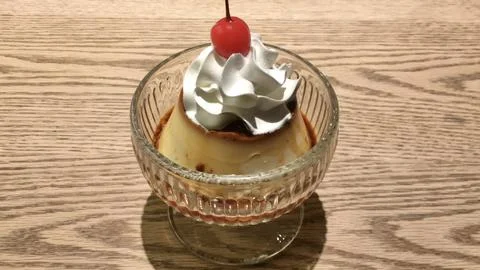 Soft and silky mini pudding served in a petite cup, with a melt-in-your-mou.. Stock Photos