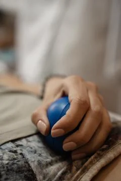 A soft ball to squeeze in your hand during a painful beauty procedure Stock Photos